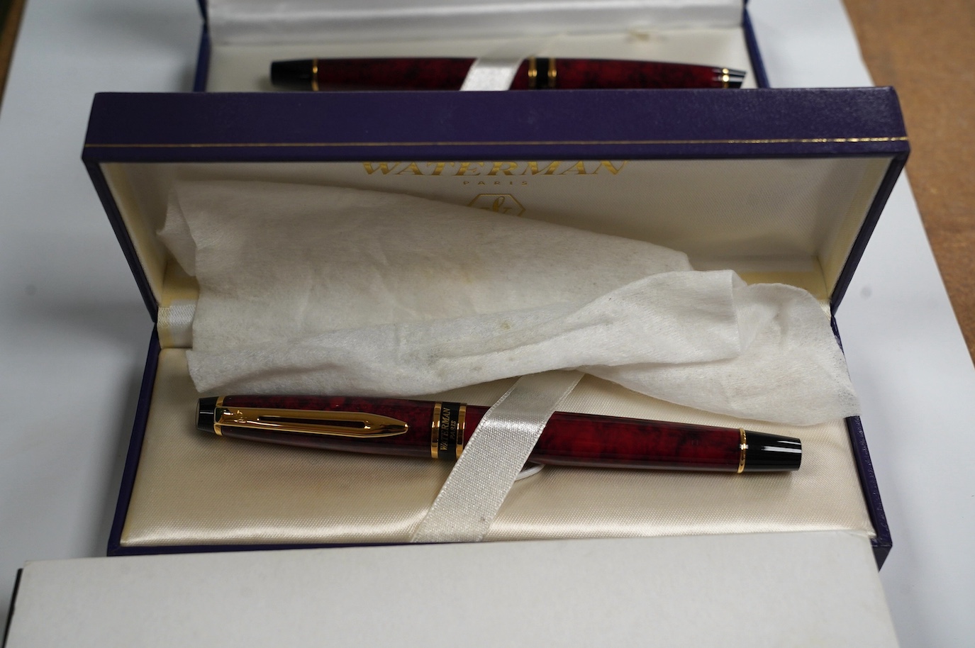 A silver mounted Sheaffer fountain pen, two cased Waterman fountain pens, a ballpoint pen branded for Boeing, and a Queen Elizabeth II pen and cufflink set. Condition - fair to good